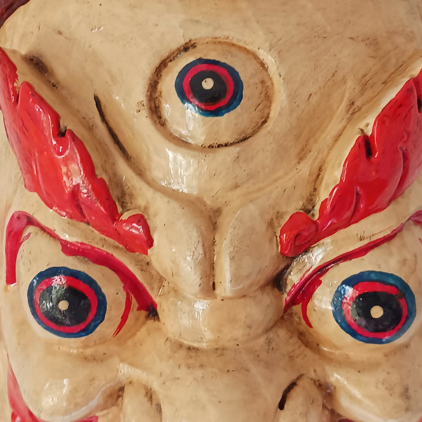 This Mahakala mask is a beautifully handcrafted wooden piece featuring intricate details and a unique design. Inspired by the powerful deity, this mask is a representation of strength, protection, and courage. 