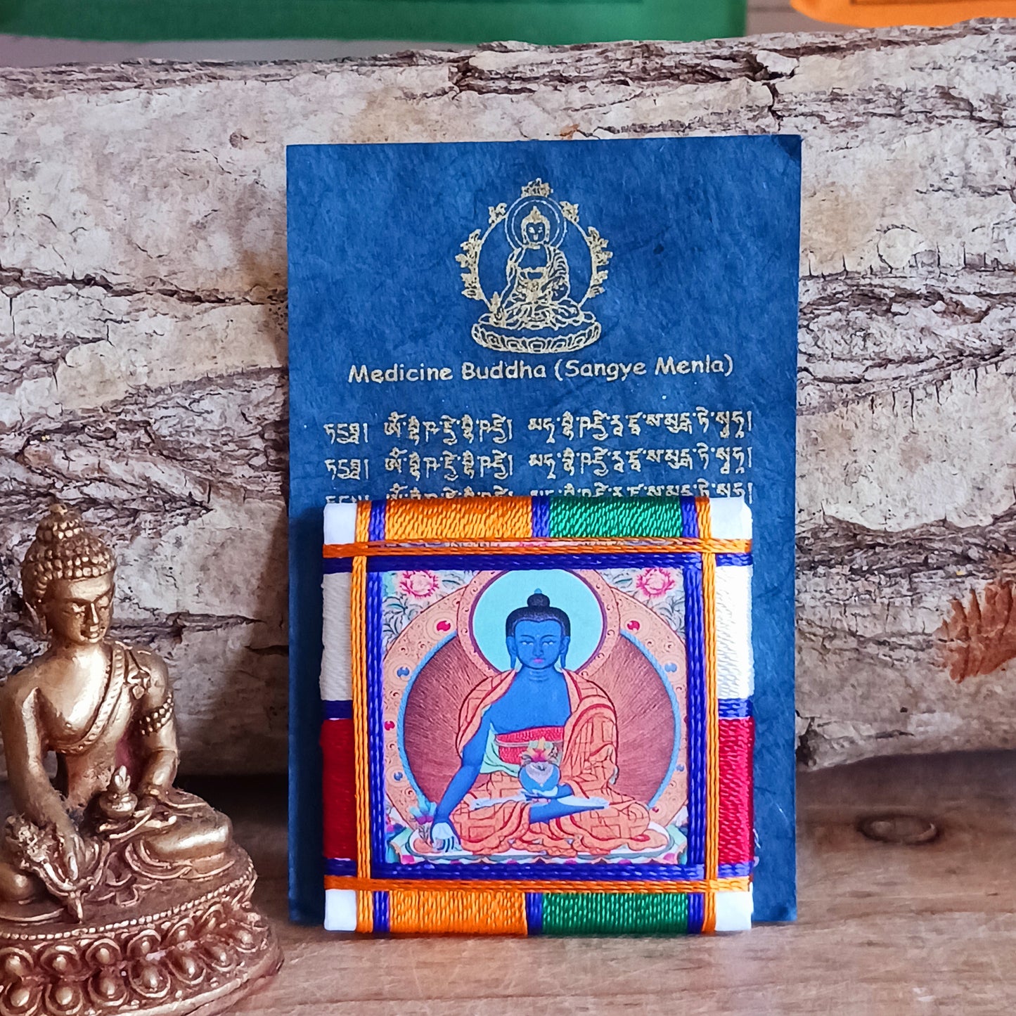 The healing embrace of the Medicine Buddha Protection Amulet, a sacred creation handmade in Nepal.