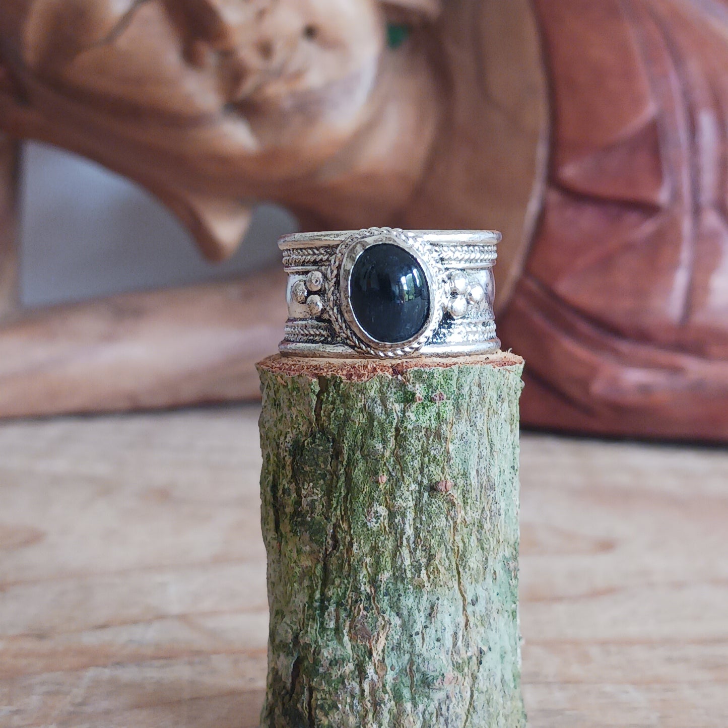 Nepalese white metal finger ring decorated with a black tourmaline stone.