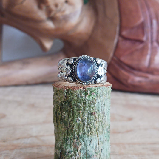 Nepalese white metal finger ring decorated with an amethyst stone.