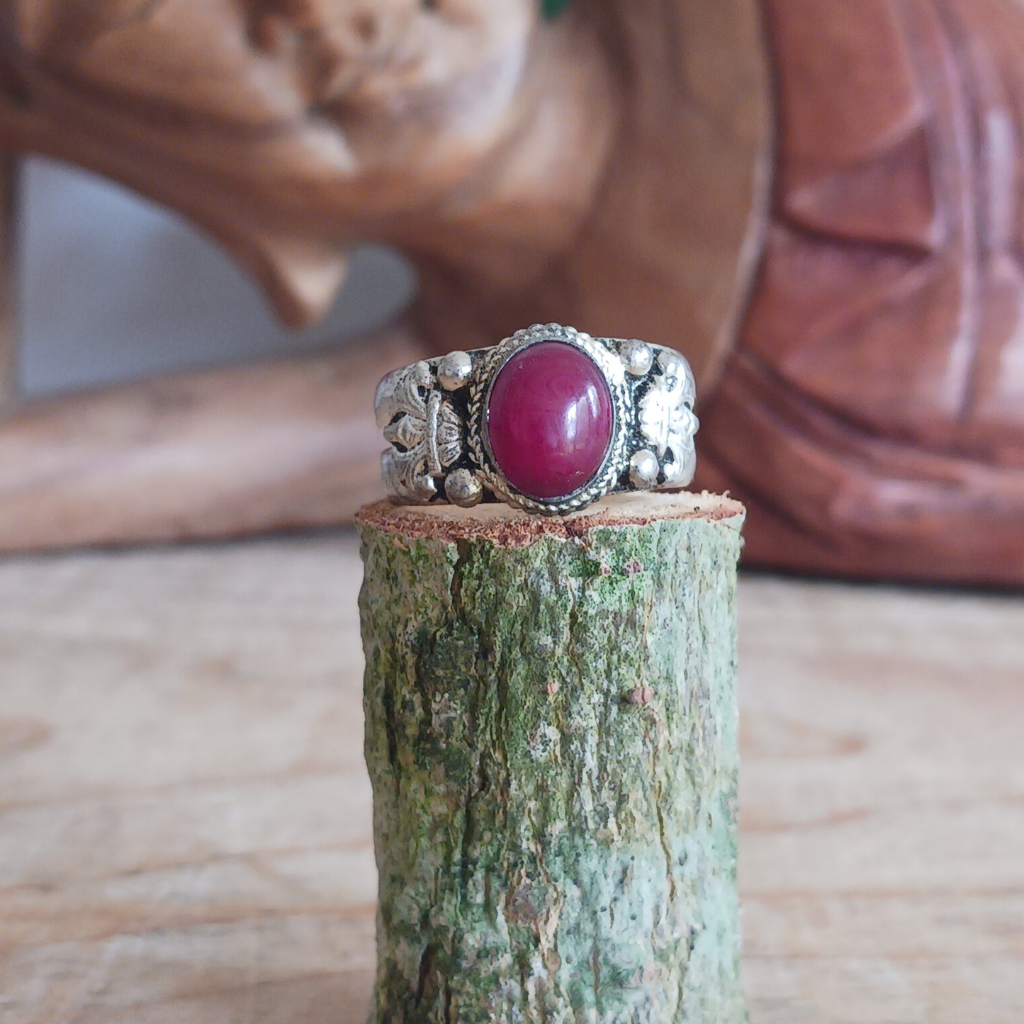 Nepalese white metal finger ring decorated with a red coral stone.