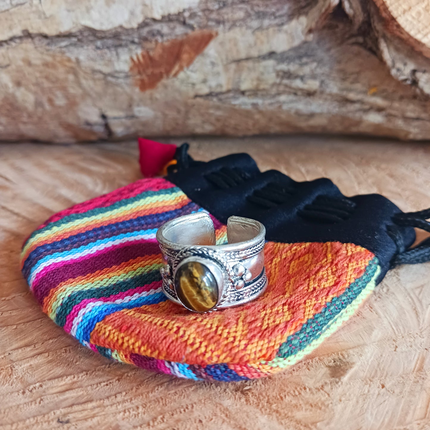 Tibetan white metal finger ring decorated with Tiger's Eye stone.