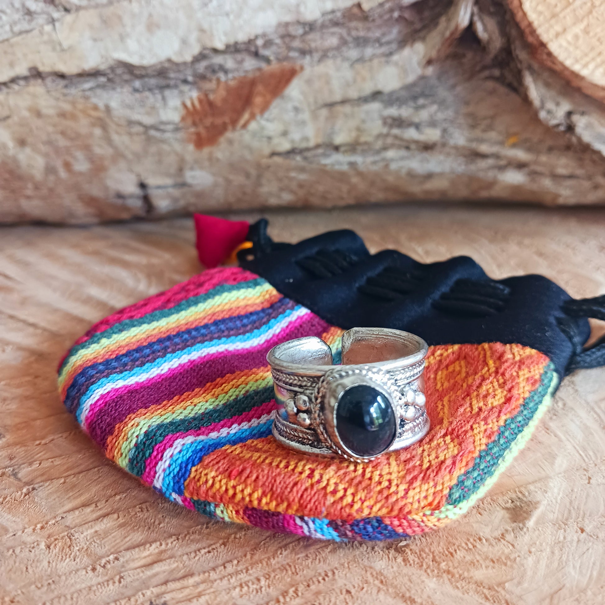 Nepalese white metal finger ring decorated with a black tourmaline stone.