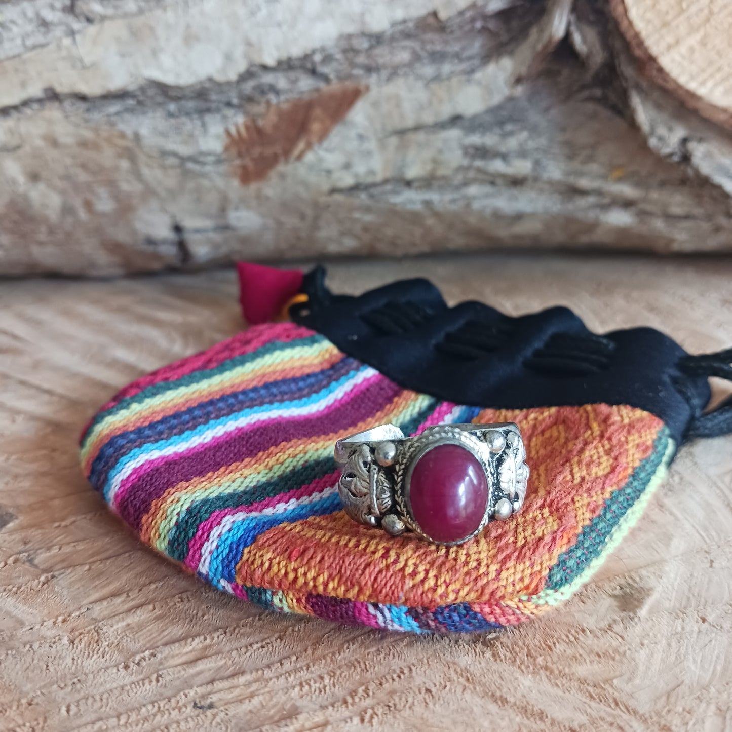 Nepalese white metal finger ring decorated with a red coral stone.