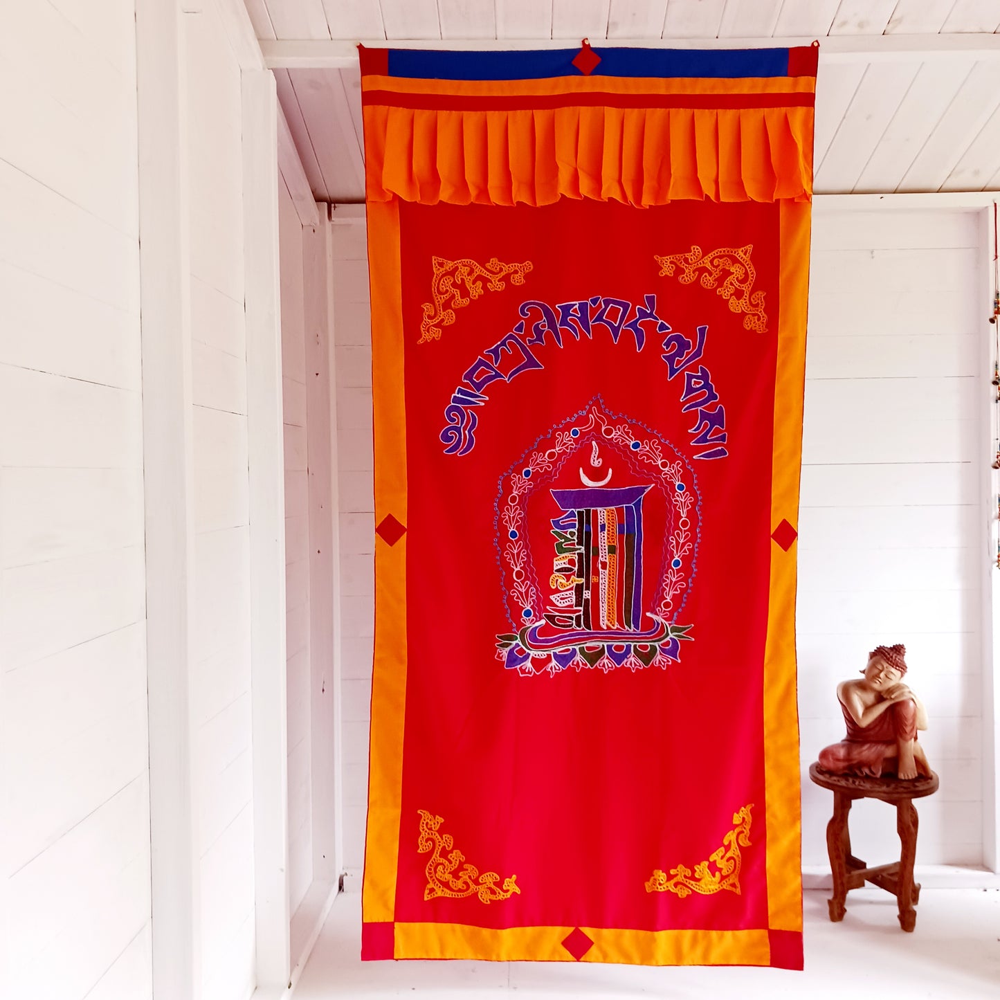 A fine quality traditional Tibetan door curtain displaying a hand embroidered Kalachakra. 