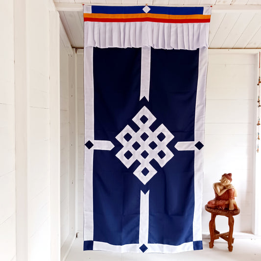 This is a beautifully patched Endless Knot on blue cotton Tibetan Buddhist door curtain.