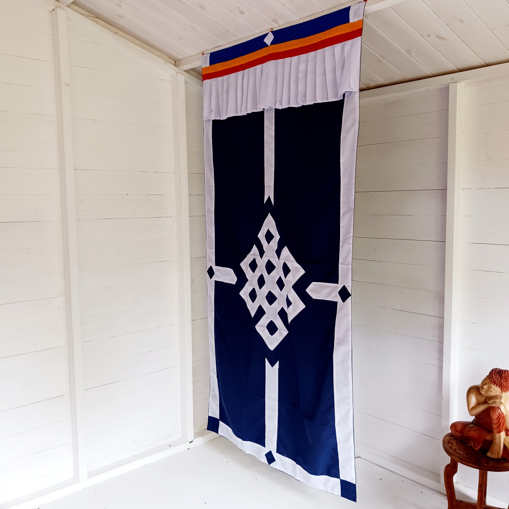 This is a beautifully patched Endless Knot on blue cotton Tibetan Buddhist door curtain.