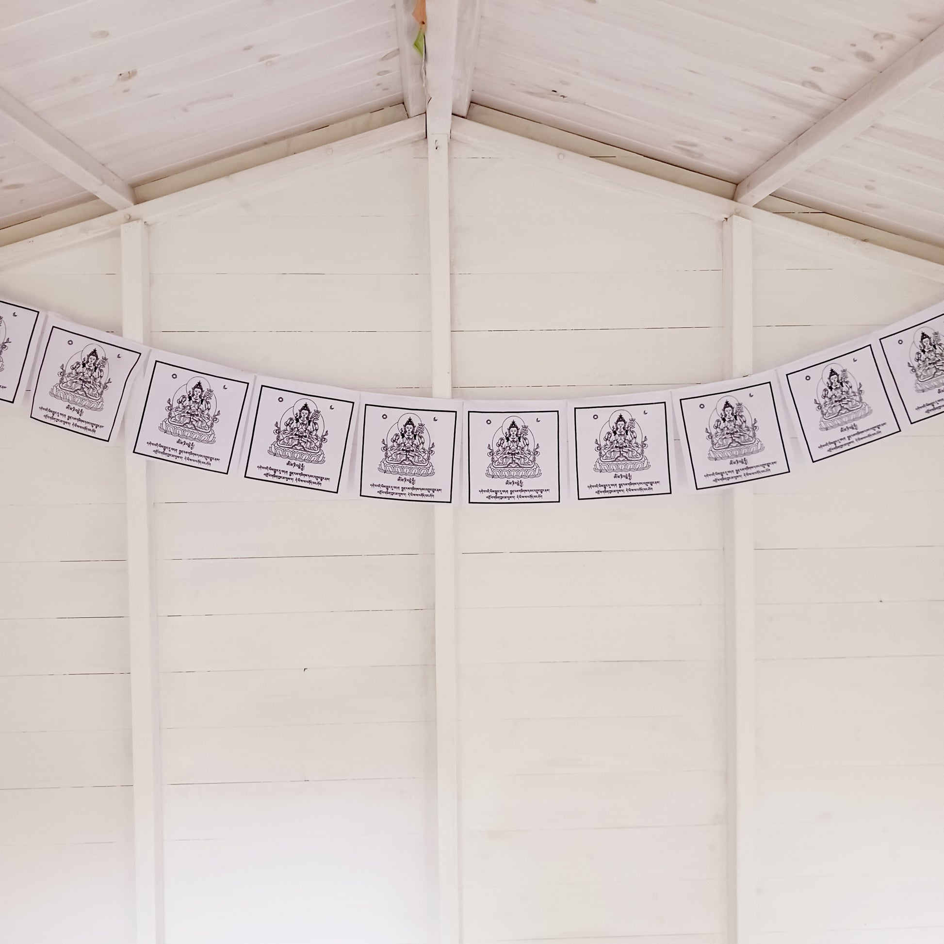 Experience the tranquil and compassionate energy of Chenrezig solid white Tibetan Prayer Flags. 