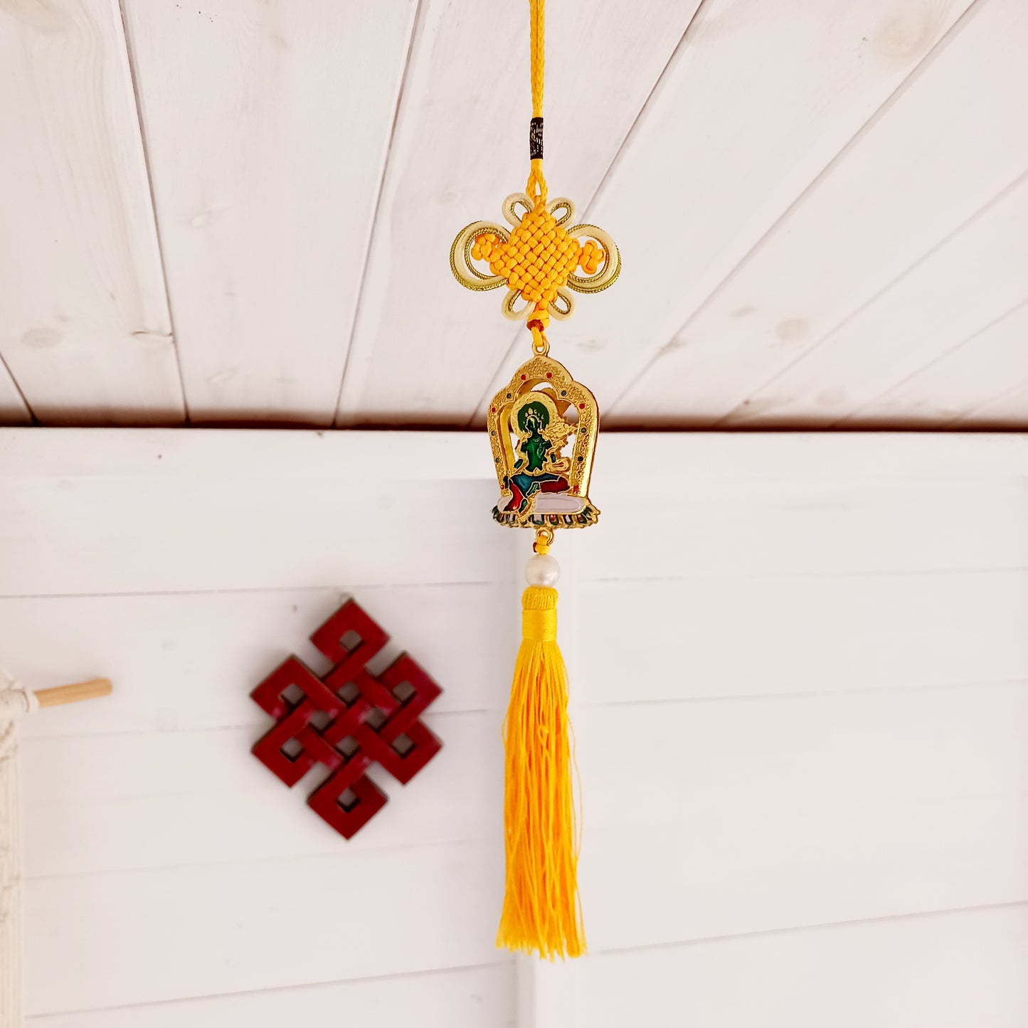 This beautifully decorated Green Tara Tibetan Buddhist amulet can be used as a wall hanging or car hanging decoration.