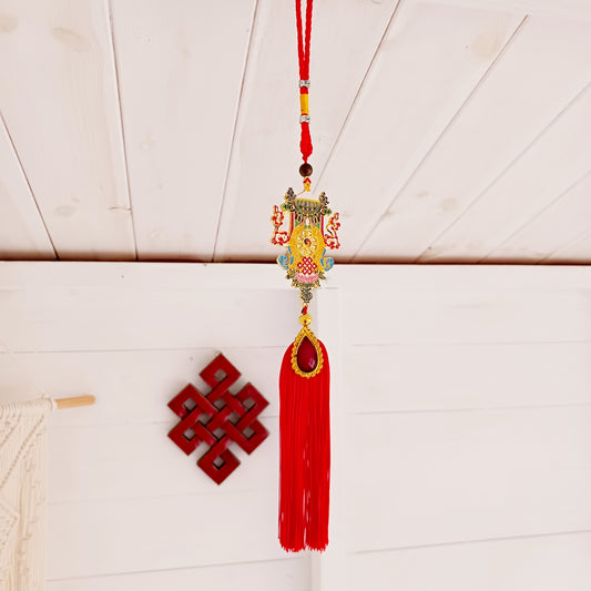 This beautifully decorated Auspicious Symbols Tibetan Buddhist amulet can be used as a wall hanging or car hanging decoration.