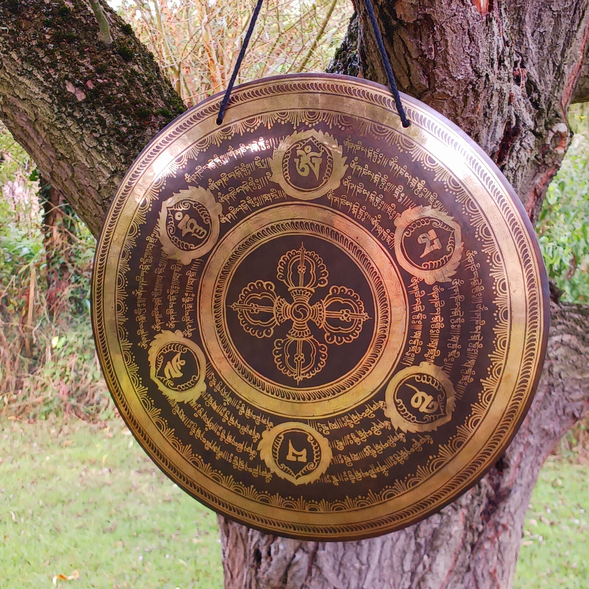 This is a beautiful hand beaten Tibetan Gong, hand-etched with Tibetan Buddhist Mantra, designs and motifs, including a Double Dorje in the centre.