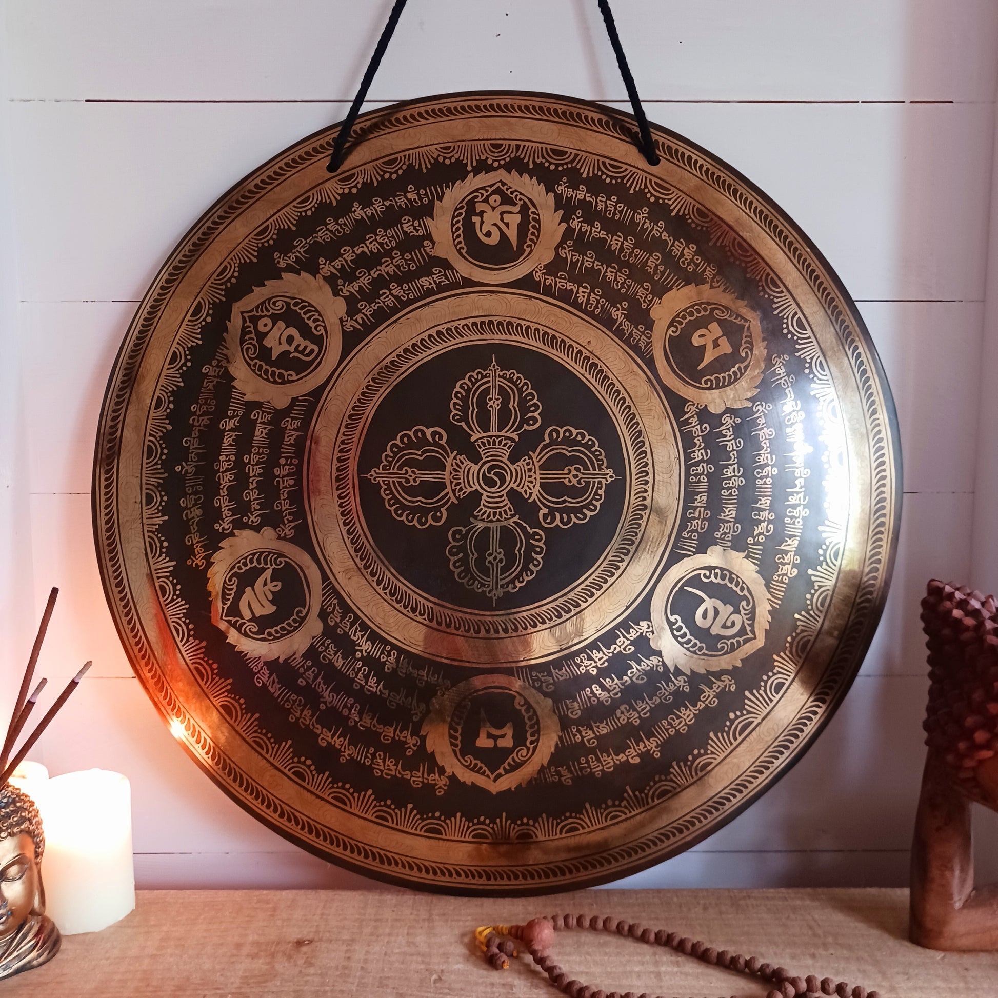 This is a beautiful hand beaten Tibetan Gong, hand-etched with Tibetan Buddhist Mantra, designs and motifs, including a Double Dorje in the centre.