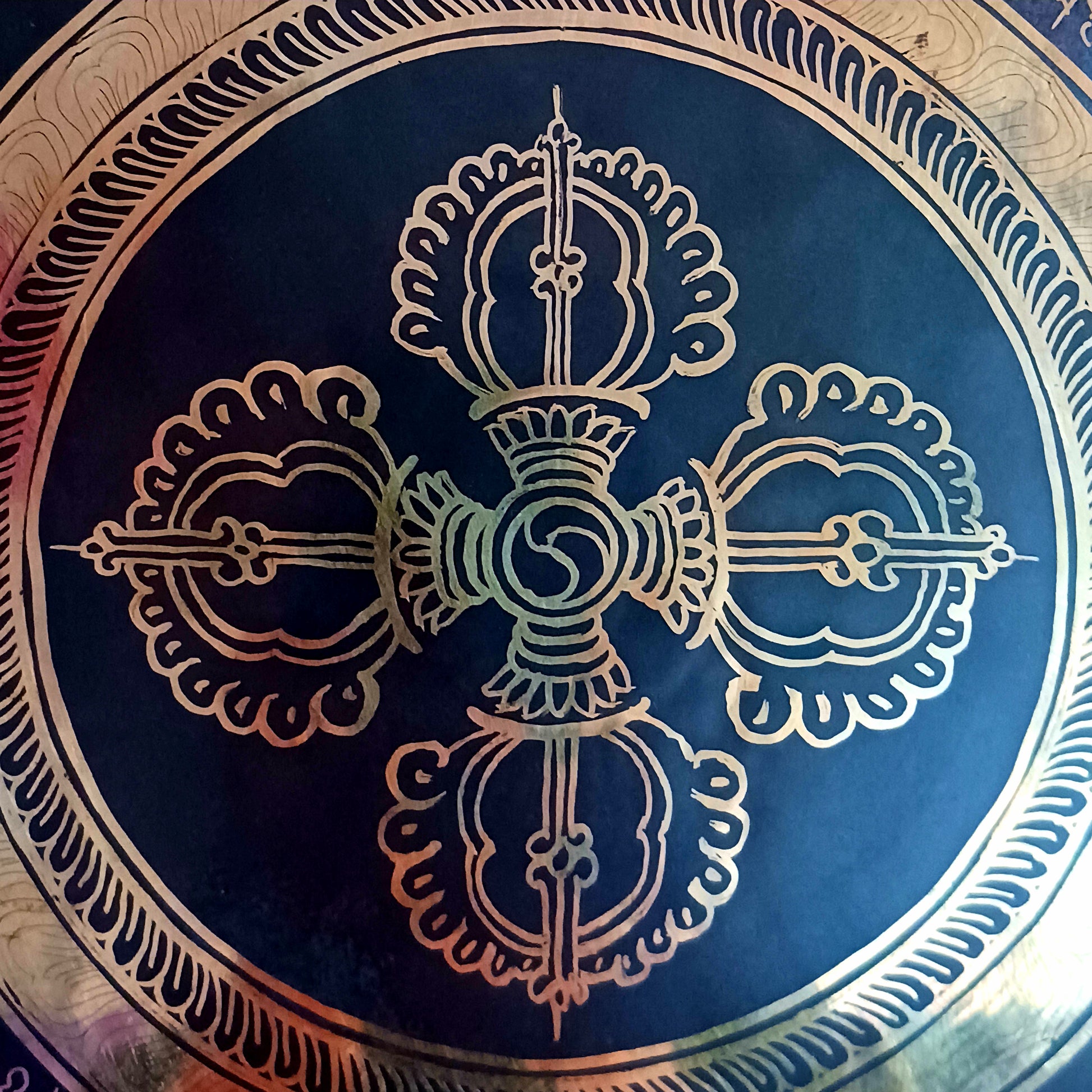 This is a beautiful hand beaten Tibetan Gong, hand-etched with Tibetan Buddhist Mantra, designs and motifs, including a Double Dorje in the centre.