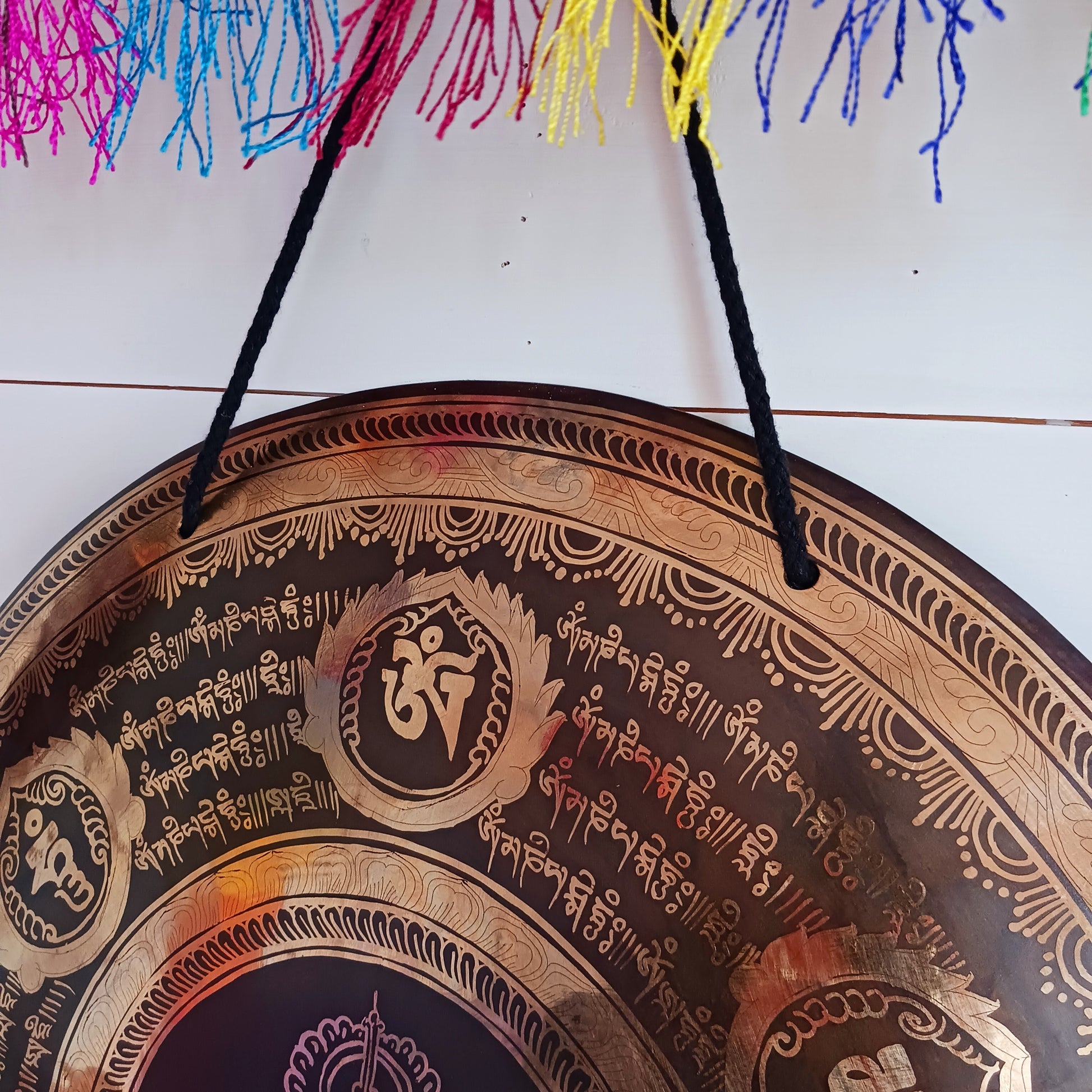 This is a beautiful hand beaten Tibetan Gong, hand-etched with Tibetan Buddhist Mantra, designs and motifs, including a Double Dorje in the centre.