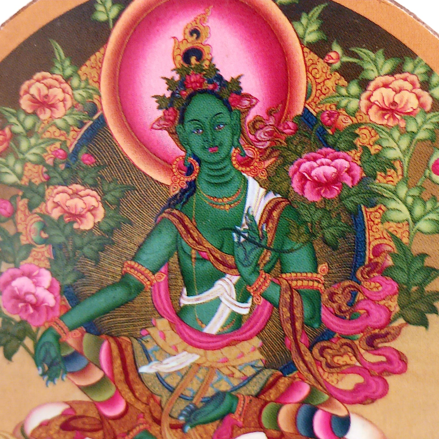 Green Tara is a female Buddha. Her name means Star or bridge, transition. Metaphor for: she who helps to cross the ocean of suffering. Green Tara is depicted as a young girl or woman, relaxed, playful and dynamic. 