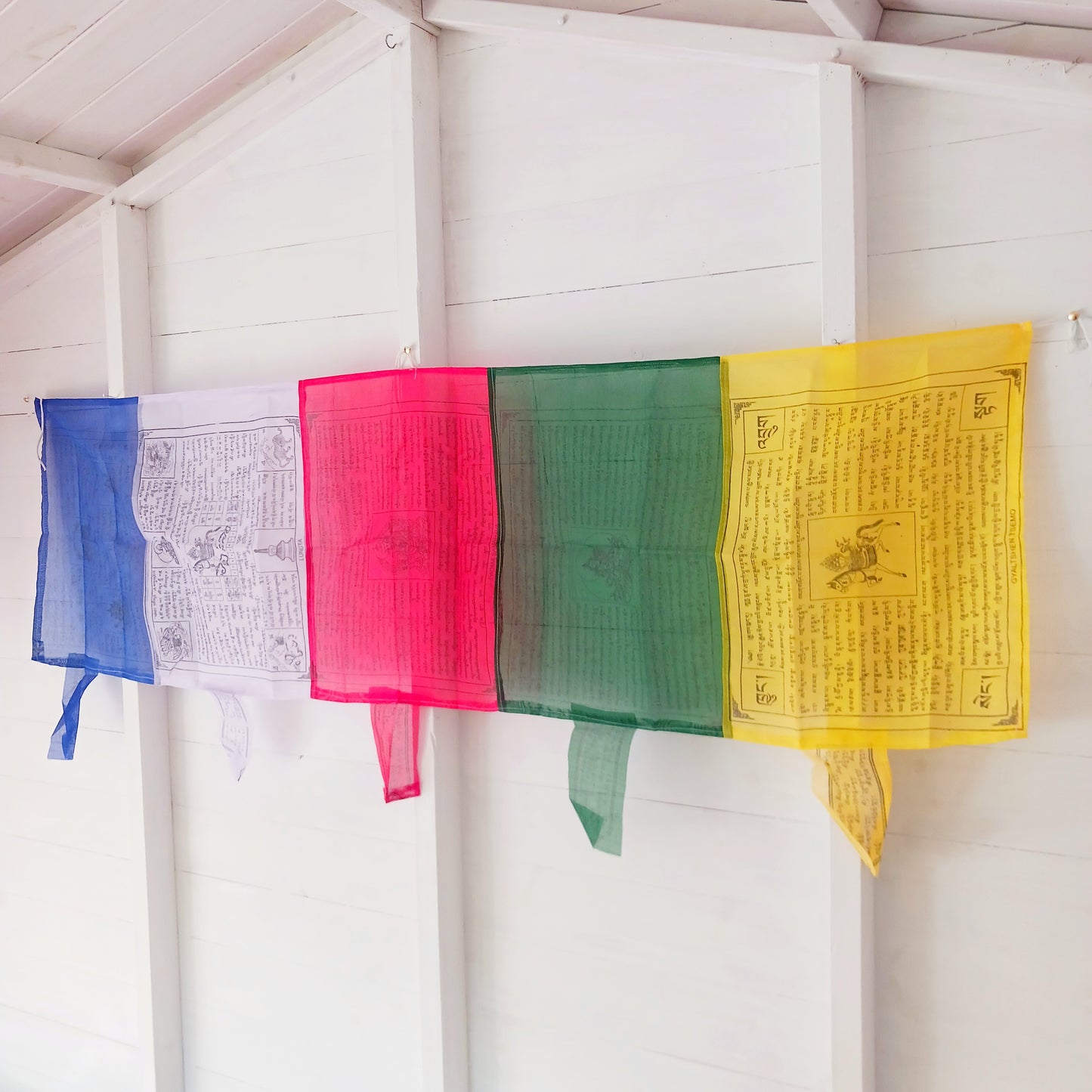 The colours of the Tibetan Prayer Flags symbolize the five elements. blue-wind, white-water, red-fire, green-space and yellow-earth. The Tibetan Prayer Flag contain phrases requesting good health and fortune.