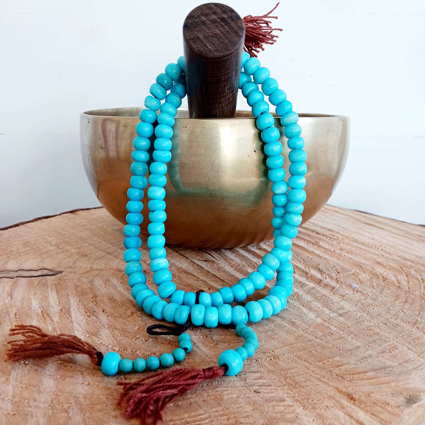 These prayer beads are used to count repeated mantras, serving the same purpose as a rosary. Beads made of semi-precious stones, pearls, bodhi seeds or wood may serve all kinds of goals, like counting any kind of mantras, or other forms of prayer, bows, walk-rounds and such. The cord is the same for every mala, and should be made of nine threads, symbolising the Buddha Vajradhara and the eight Bodhisattvas. The larger bead at the end stands for wisdom, realising emptiness, and the cylindrical bead on 