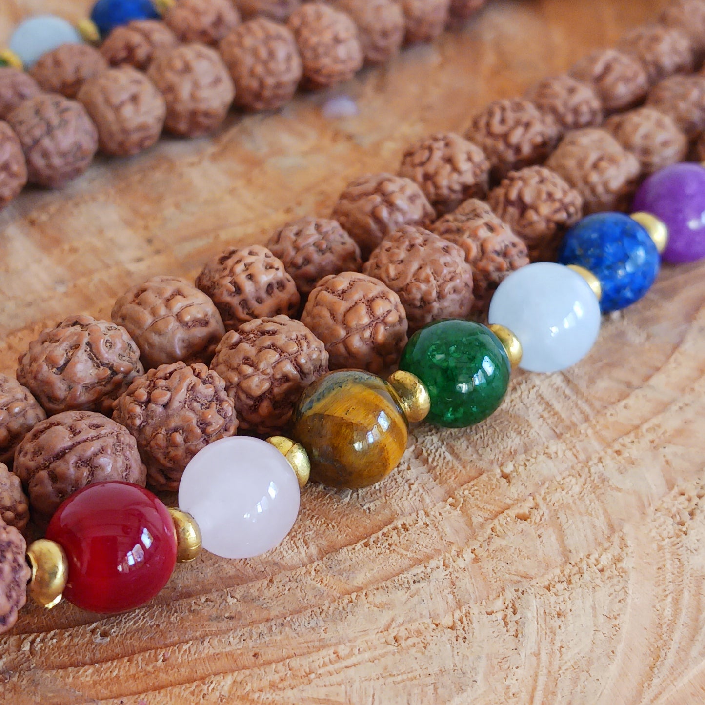 Many individuals wear Rudraksha beads to enhance their spiritual practices, meditation and prayers. Positive Energy and Protection: The unique vibrations and energies associated with Rudraksha beads are believed to create a protective shield around the wearer. These beads come with gemstone beads.