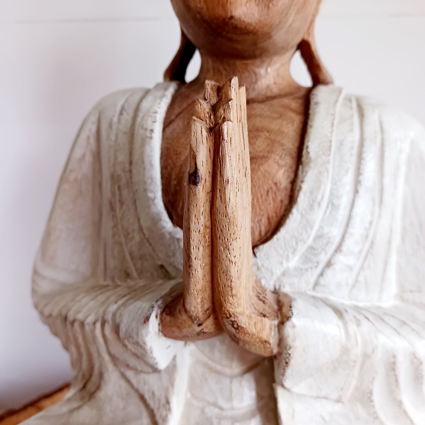 This Buddha statue has been carved by hand from Suar wood which is a fast-growing species, allowing for sustainable cultivation. The Albizia Saman species of tree is widespread, abundant, and in no danger of extinction. The Buddha is carved using tools in the traditional Balinese way, bringing each detail to life in a three-dimensional work of art. Hand carved Buddha statues can take up to weeks to carve and this particular Buddha has a white-wash finish.