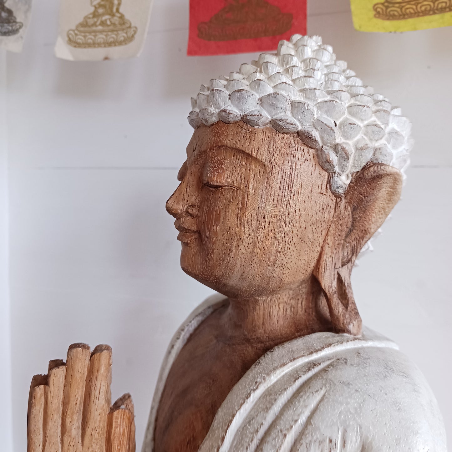 This Buddha statue has been carved by hand from Suar wood which is a fast-growing species, allowing for sustainable cultivation. The Albizia Saman species of tree is widespread, abundant, and in no danger of extinction. The Buddha is carved using tools in the traditional Balinese way, bringing each detail to life in a three-dimensional work of art. Hand carved Buddha statues can take up to weeks to carve and this particular Buddha has a white-wash finish.