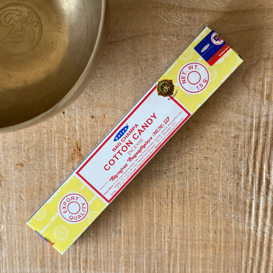 Enjoy the sweet, playful fragrance of Satya Nag Champa Cotton Candy Incense Sticks, bringing a deliciously sugary aroma to your surroundings. This distinctive Satya fragrance combines the traditional character of Nag Champa incense with a soft, sweet cotton candy-inspired scent, creating a warm and uplifting atmosphere. Perfect for adding fragrance to the home, bedroom, meditation space or relaxation area, these incense sticks can be enjoyed while unwinding, practising yoga or simply relaxing. Each box cont