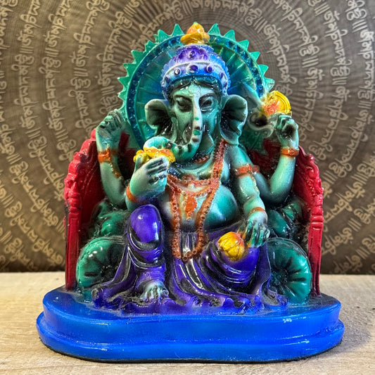 Hand-painted 15 cm resin Ganesh statue holding lotus, axe, and sweets.