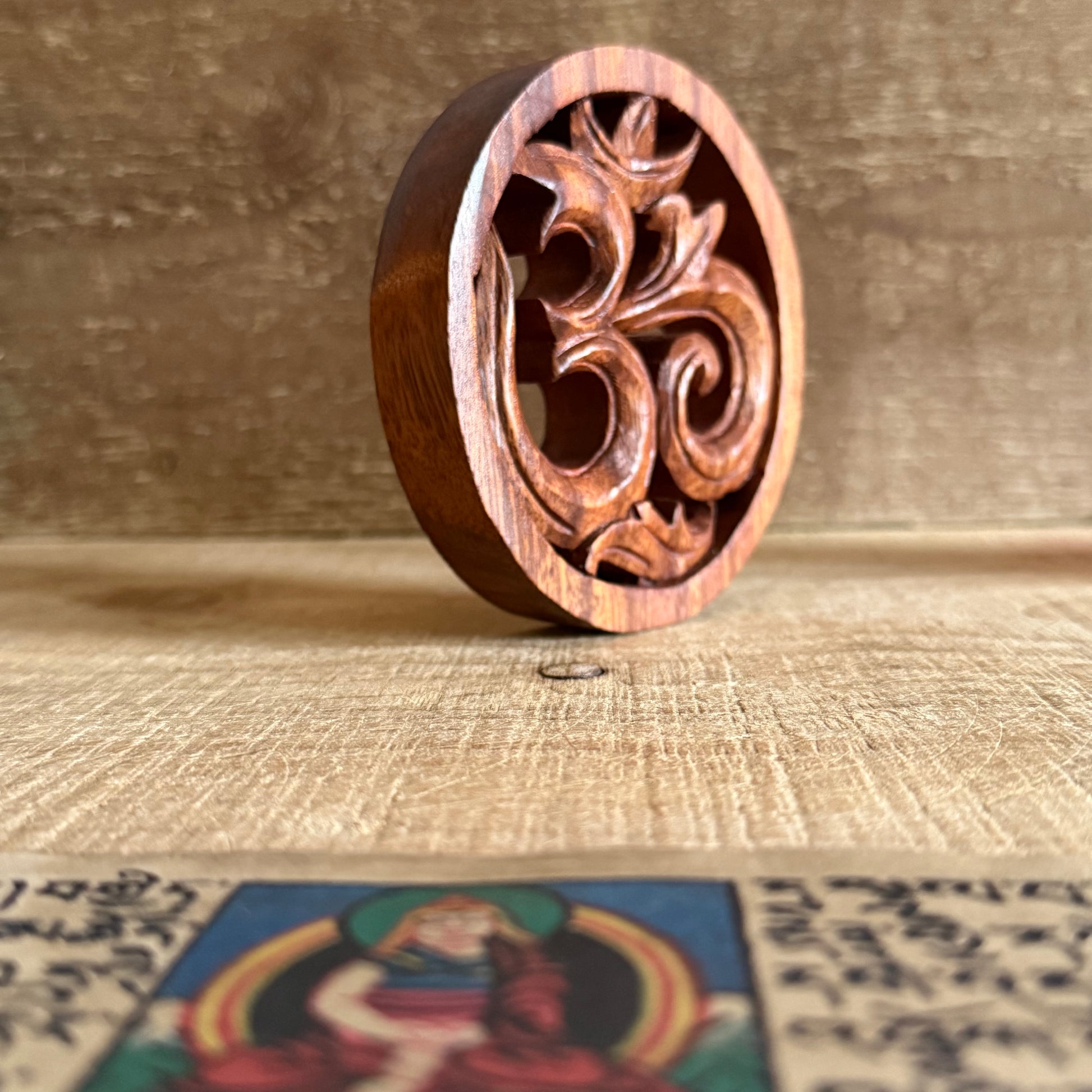 Invite harmony and sacred energy into your home with this Hand Carved Wooden Om Wall Hanging, beautifully crafted from sustainably sourced suar wood. Each piece is individually hand carved by skilled artisans, honouring the traditional techniques that celebrate both craftsmanship and spirituality.