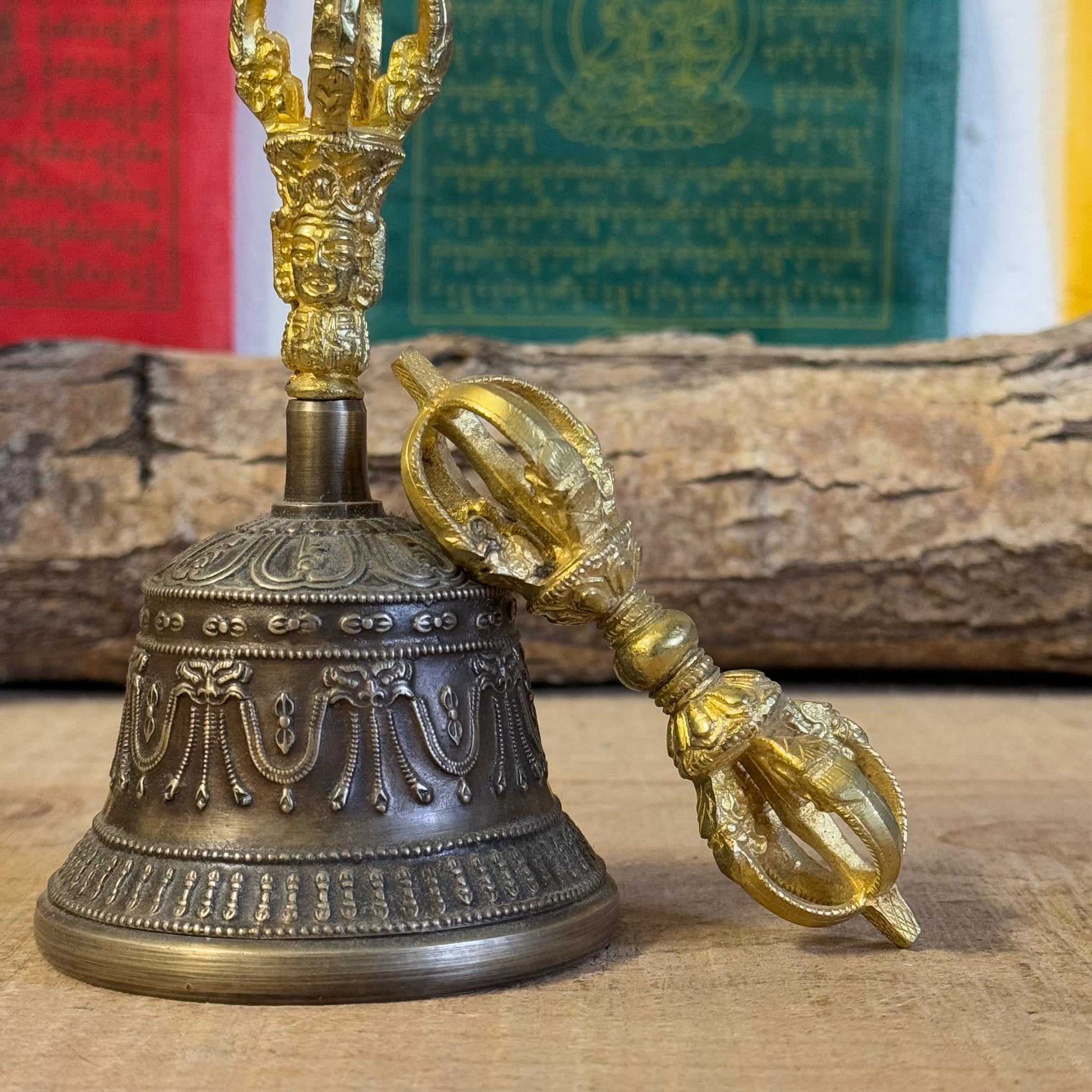 Discover the intricately engraved Kirtimukha Bell and Dorje Set, a primary ritual tool in Tibetan Buddhism. Handcrafted in Nepal, this bronze and brass set symbolizes wisdom and compassion, perfect for rituals and meditation.