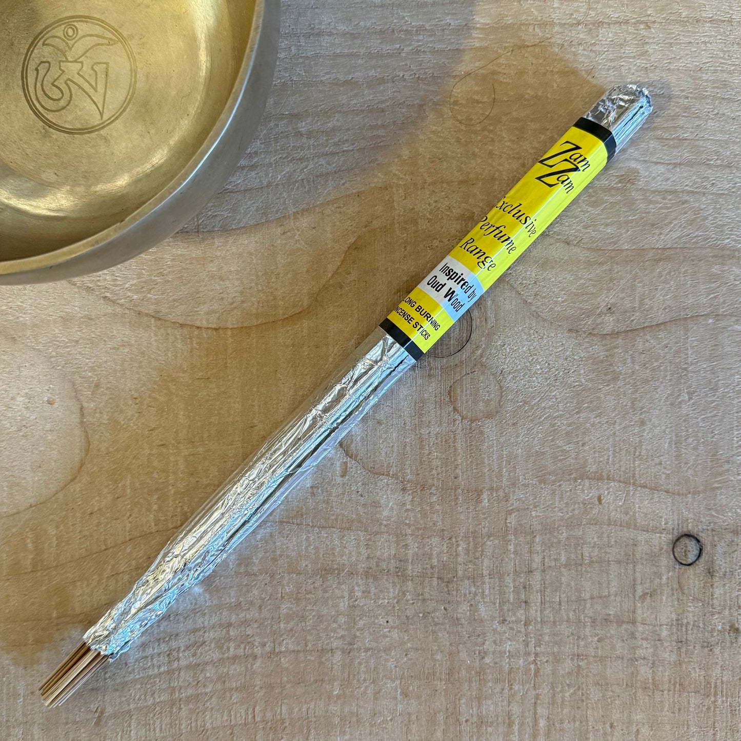 Zam Zam Oud Wood incense sticks with a deep woody aroma. Long burning hand rolled incense for meditation, rituals, and sacred spaces.