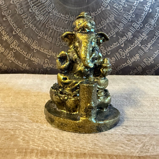 Small resin Ganesh incense holder in golden finish. Perfect for meditation, altar use, rituals, and bringing auspicious energy into your home.