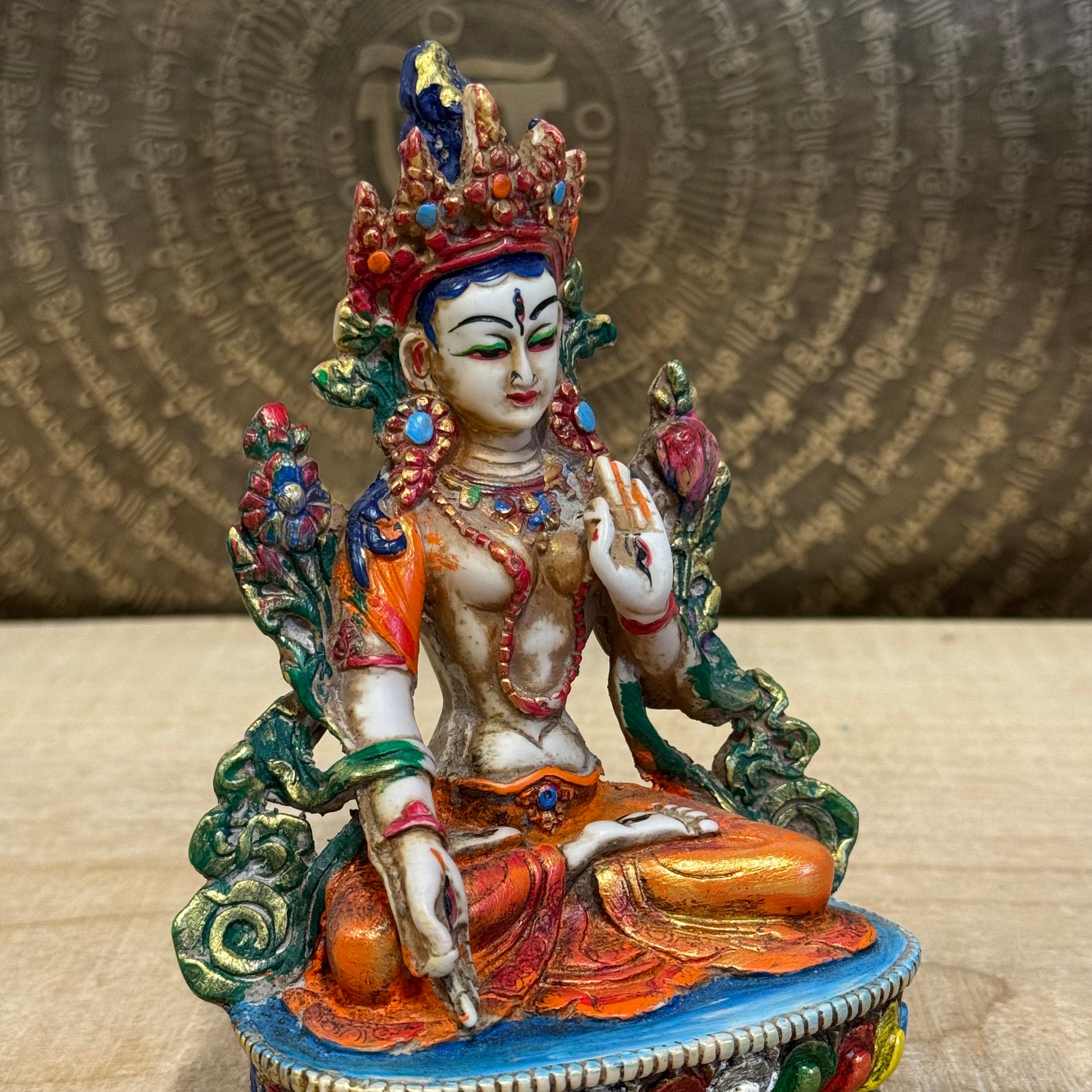 White Tara is known for compassion, long life, healing and serenity and is shown here with her right hand in the varada mudra (blessing pose.) White Tara is distinct from the more commonly seen Green Tara. She is seated in a tranquil, full lotus position as opposed to Green Tara's one foot extended pose. These intricate resin statues are carefully handcrafted In Nepal.

Size: 14.5cm