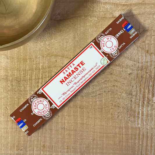 Satya Namaste Incense with a traditional sandalwood base and floral oils. Hand-rolled in India, ideal for meditation, rituals, and home fragrance.