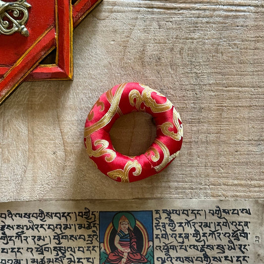 Handmade 8cm brocade singing bowl cushion, fair trade from Nepal. Perfect for stabilizing and elevating medium bowls in your healing practice.