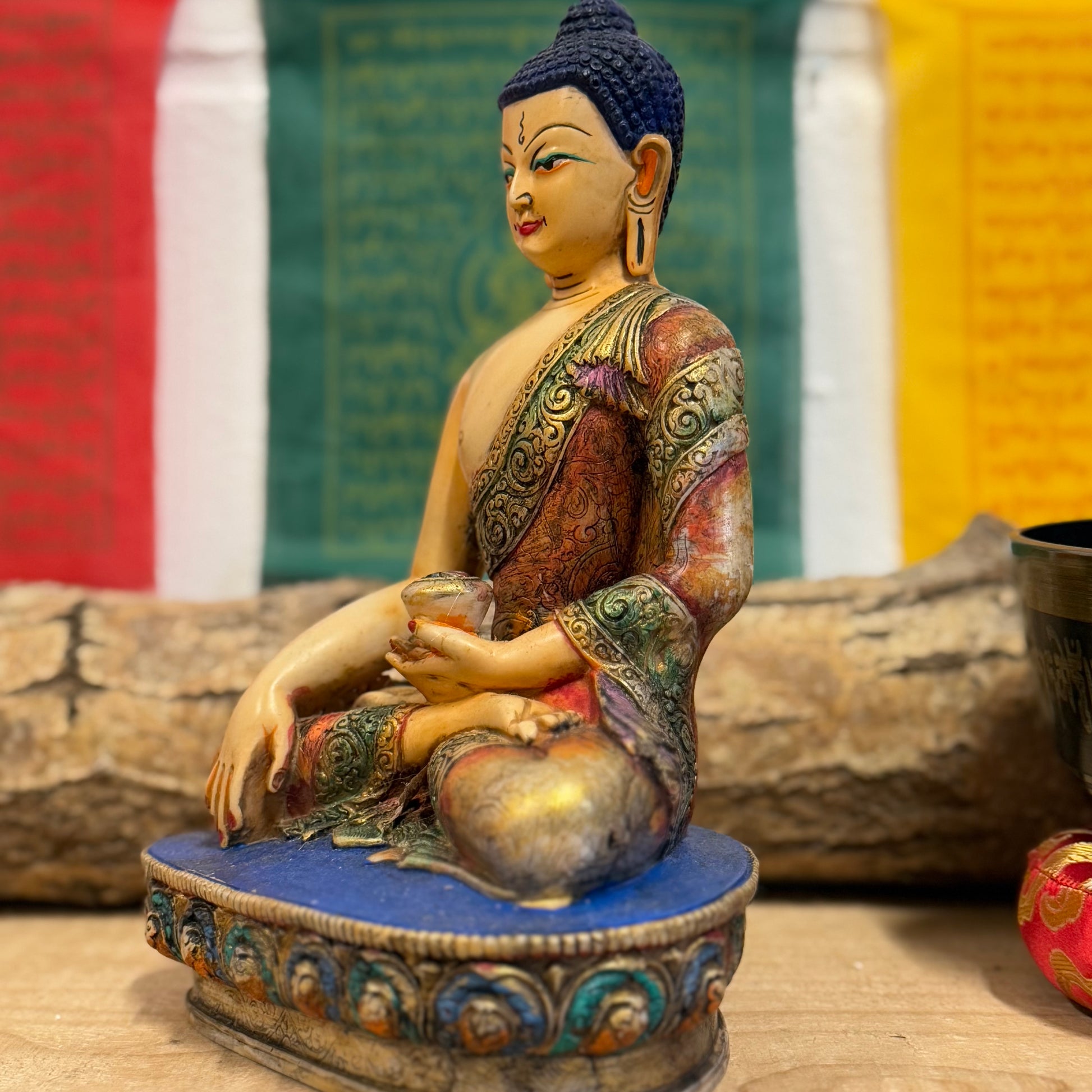 Hand-Painted Shakyamuni Buddha Statue – Traditional Thangka Style – 20cm

This stunning Shakyamuni Buddha statue, crafted from clay and resin, is a beautiful representation of supreme awareness and compassionate understanding. Painted using the traditional Thangka colors, this statue adheres to the exact color descriptions prescribed in Buddhist tradition, ensuring an authentic and vibrant depiction of the Buddha. Each piece is hand-painted by skilled artisans in Nepal, reflecting the meticulous craftsmansh