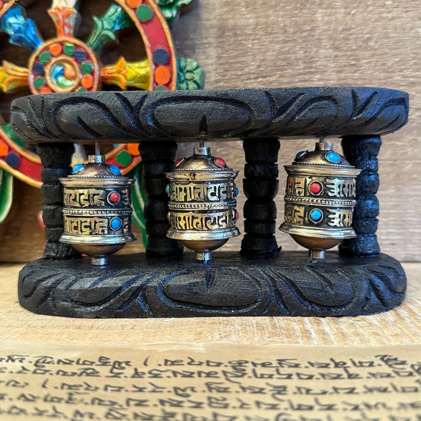 Wall Mounted Triple Copper Prayer Wheel | Buddhist Mantra Decor

Triple copper prayer wheels filled with Om Mani Padme Hum mantra. Wall-mounted in wood frame. Handmade in Nepal under Fair Trade. A sacred home addition.