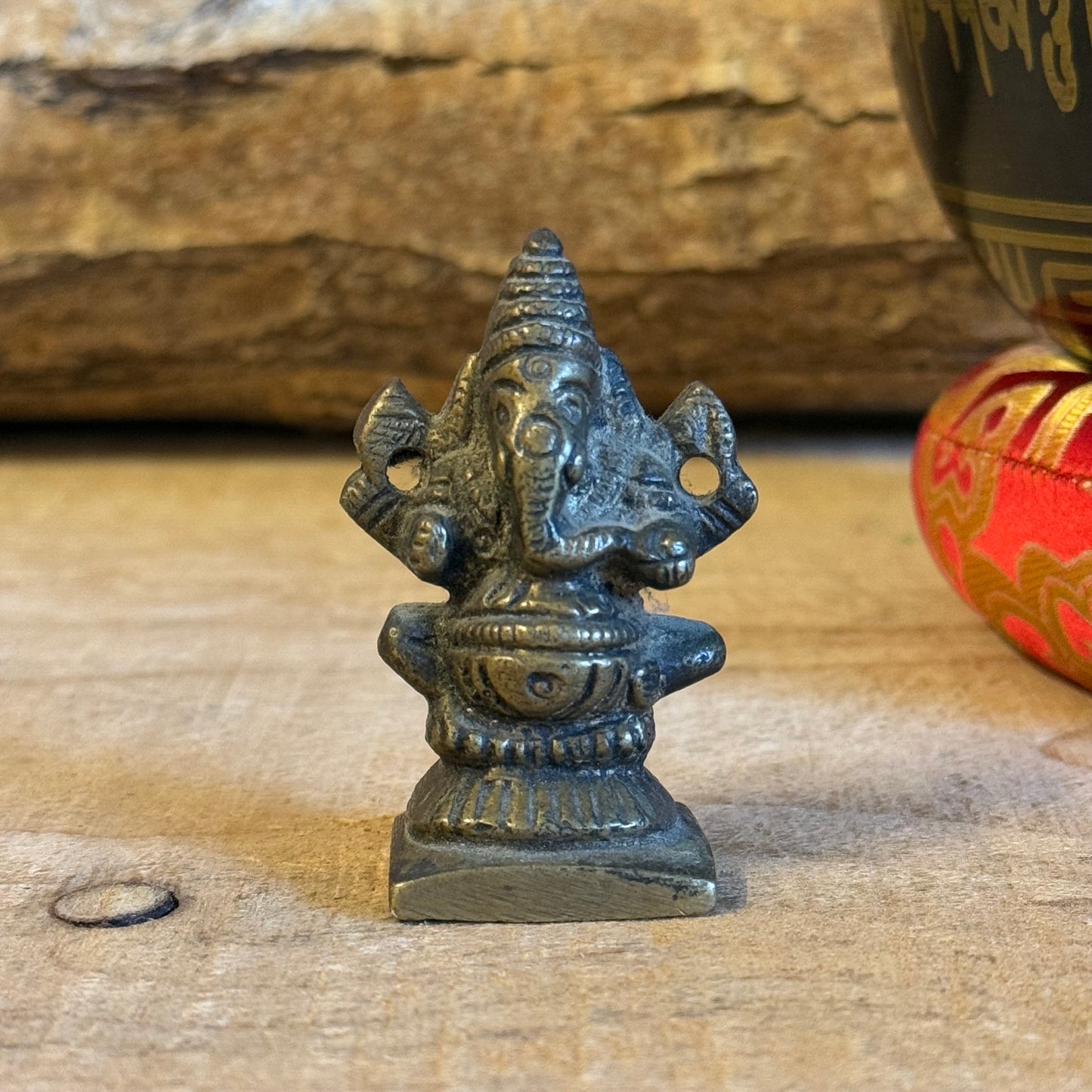 Ganesha is in the pantheon of Hinduism, but also in Buddhism, the god with the elephant head. He is the god of knowledge and wisdom, clears obstacles, and is the patron saint of travelers.