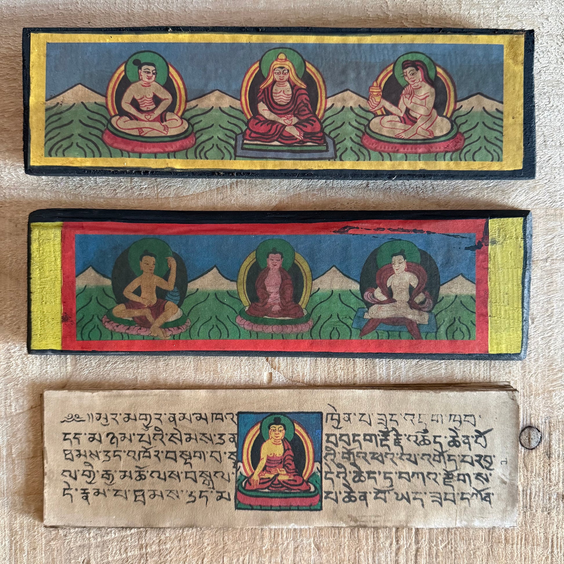 Handmade Tibetan Tantric Prayer Book with hand-painted Buddha and deities. Traditional Tibetan prayers on Daphne bark paper for health, prosperity, and meditation.
