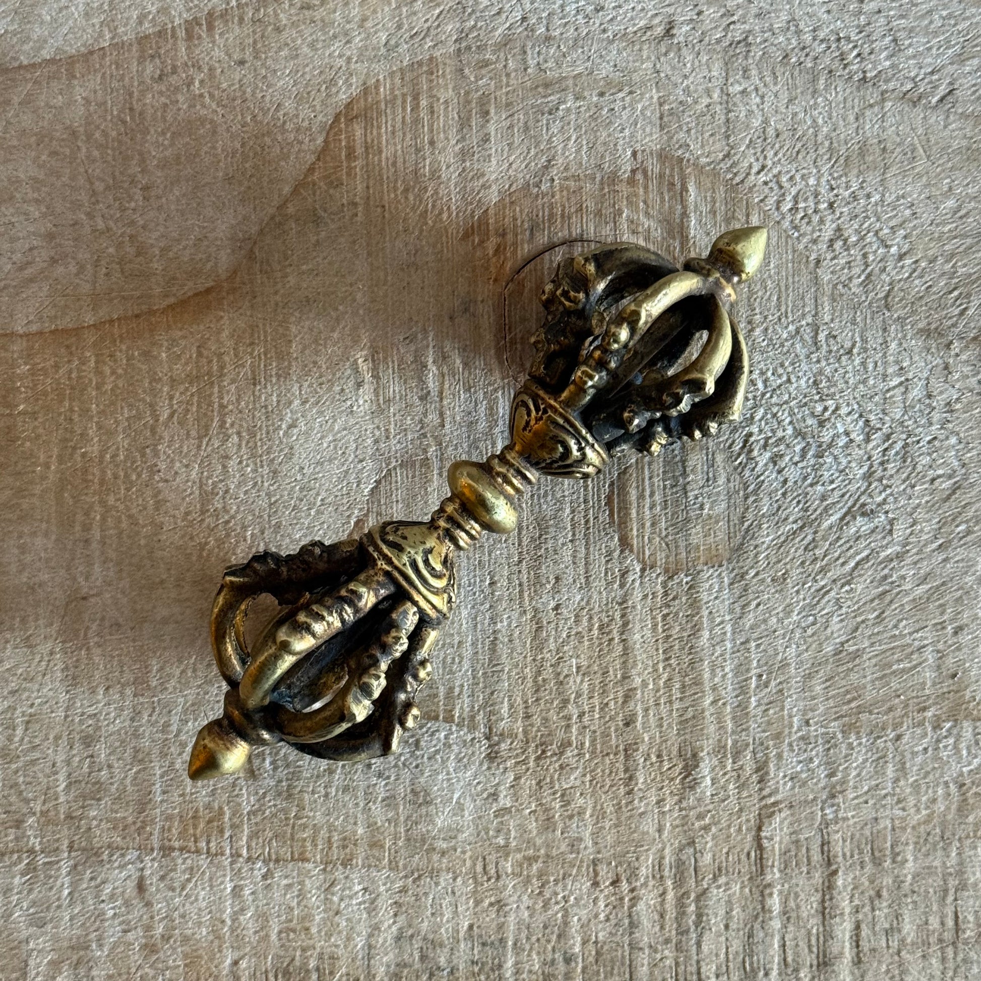 10cm Kirtimukha Dorje vajra, a sacred Tibetan Buddhist ritual object symbolising compassion, protection, and indestructible awakened action.