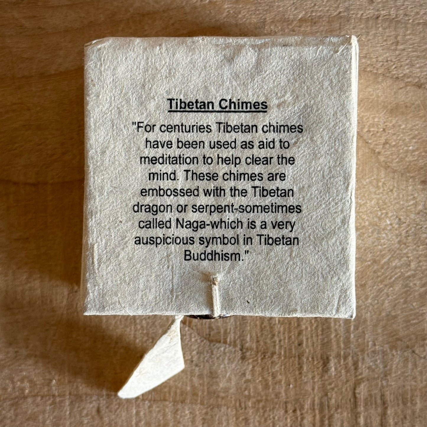 Boxed Naga Tingsha cymbals for meditation and prayer. Handcrafted in Nepal, embossed with sacred Naga or Dragon, perfect for altars and rituals.