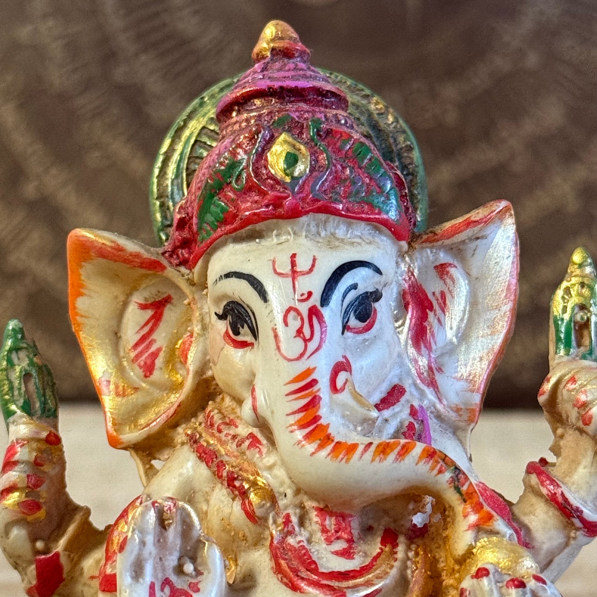 Hand-painted 9 cm Ganesh resin statue holding axe, rope, sweetmeats, blessing mudra with mouse vahana