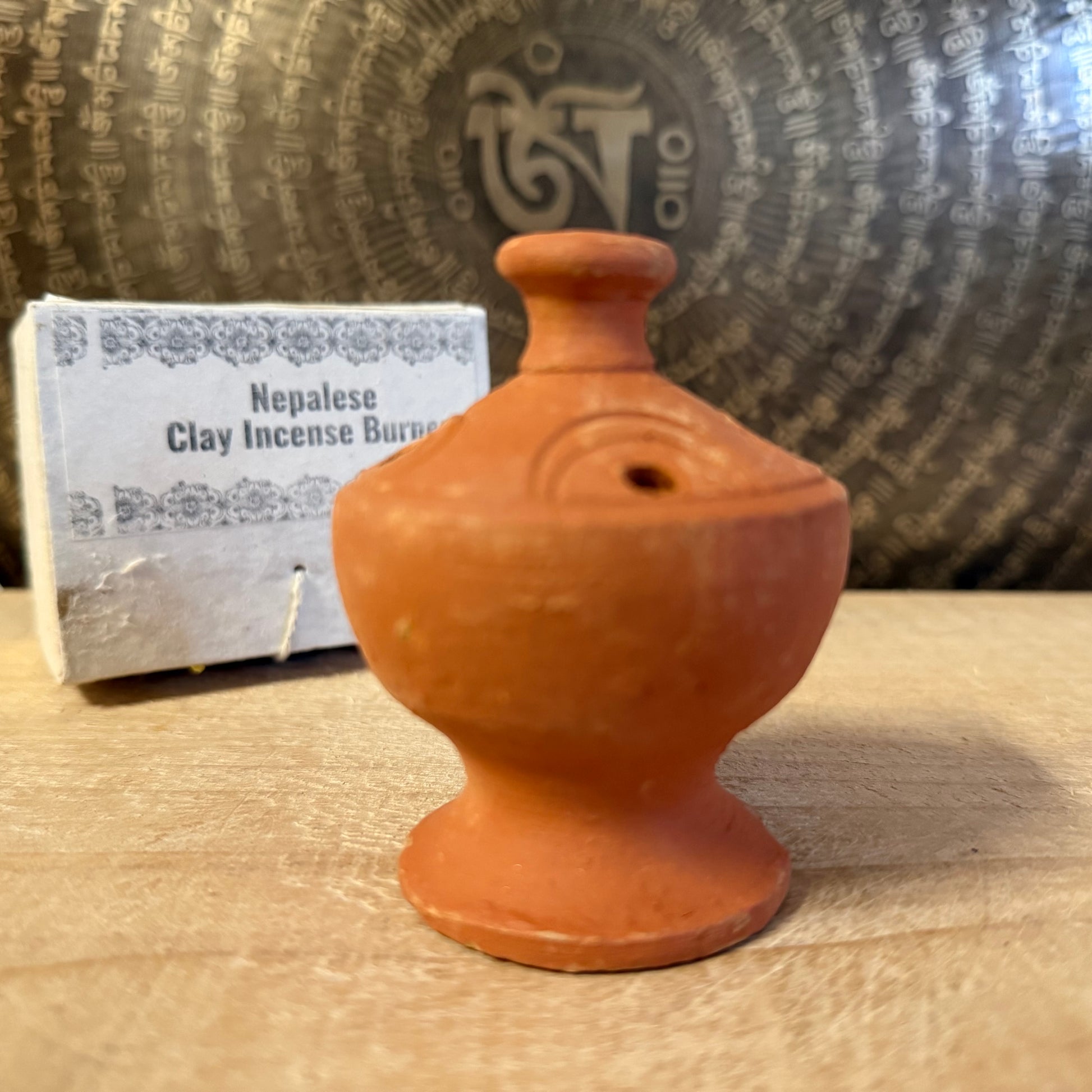 Handmade Bhaktapur pottery incense stick holder from Nepal. Fair trade clay burner for incense sticks or dhoop, ideal for meditation and ritual.