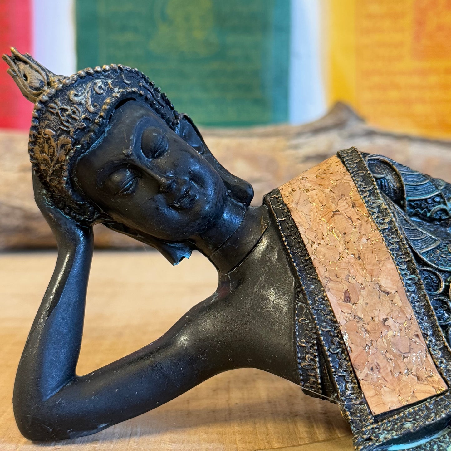 Capture the serene elegance of Buddhist artistry with this exquisite Thai-style reclining Buddha statue. Measuring 36 x 9 x 11 cm and crafted from durable poly resin, this piece combines traditional design with a timeless vintage aesthetic.