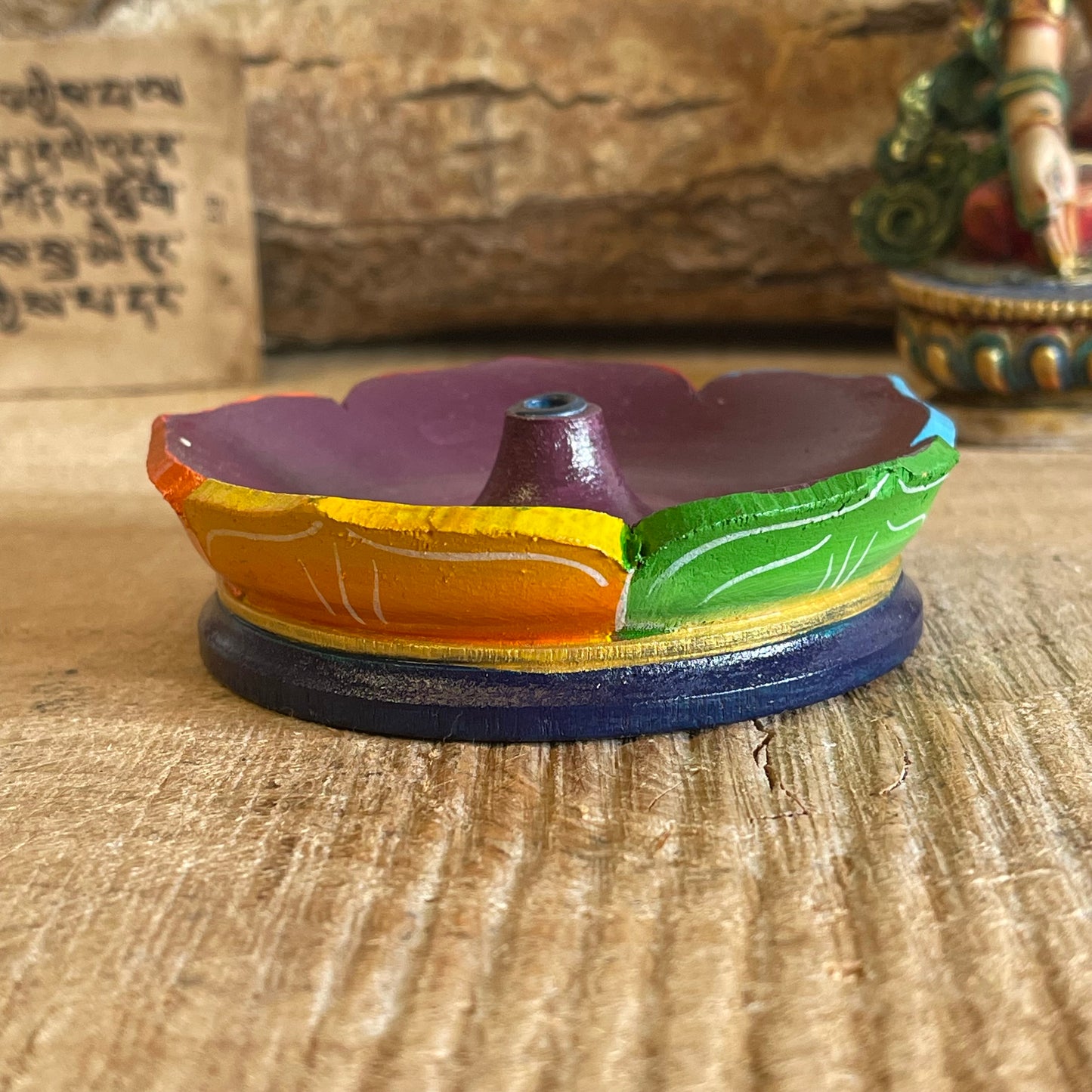 A beautiful hand painted Tibetan Incense stick holder. This handmade Lotus Incense holder is made from wood and painted in the seven chakra design in Nepal by skilled artisans. A beautifully hand-painted burner that is perfect for the larger Tibetan incense.