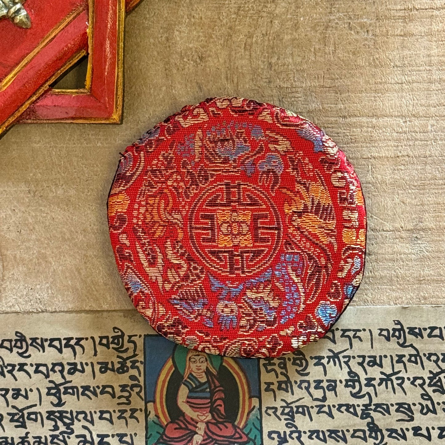 Small Round Singing Bowl Cushion | Buddhist singing Bowl Accessories

Enhance your practice with our brocade singing bowl cushion. Handmade in Nepal, it stabilizes your bowl for pure sound and adds beauty to your sacred space.