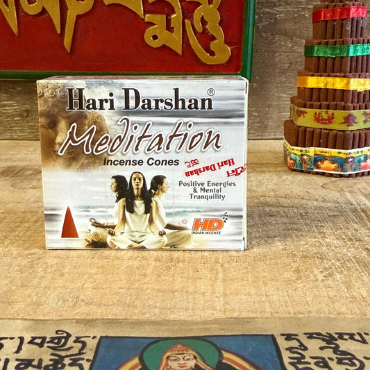 Set the mood for a calm and peaceful mind with Hari Darshan Meditation Incense Cones, handcrafted in Bangalore, India, by the traditional incense masters of Hari Darshan. Created to support moments of reflection and inner stillness, these cones release a mellow, soothing fragrance that helps you relax, unwind, and stay grounded.

Perfect for meditation, yoga, or mindfulness, their gentle aroma brings balance and clarity to your space, allowing you to let go of tension and return to the quiet centre of your 