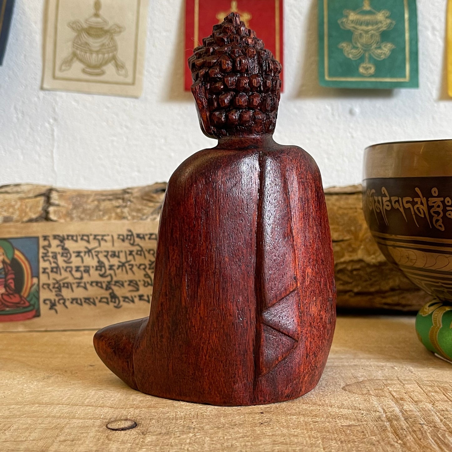 A stunning, hand carved wooden figure of Buddha, the founder of Buddhism. Our Buddhas have been hand carved in Bali using traditional methods of the island. Each carver has taken years perfecting his or her skill to be able to create work to this standard.  Hand carved wooden sitting Buddha  Made from Raintree wood in Bali