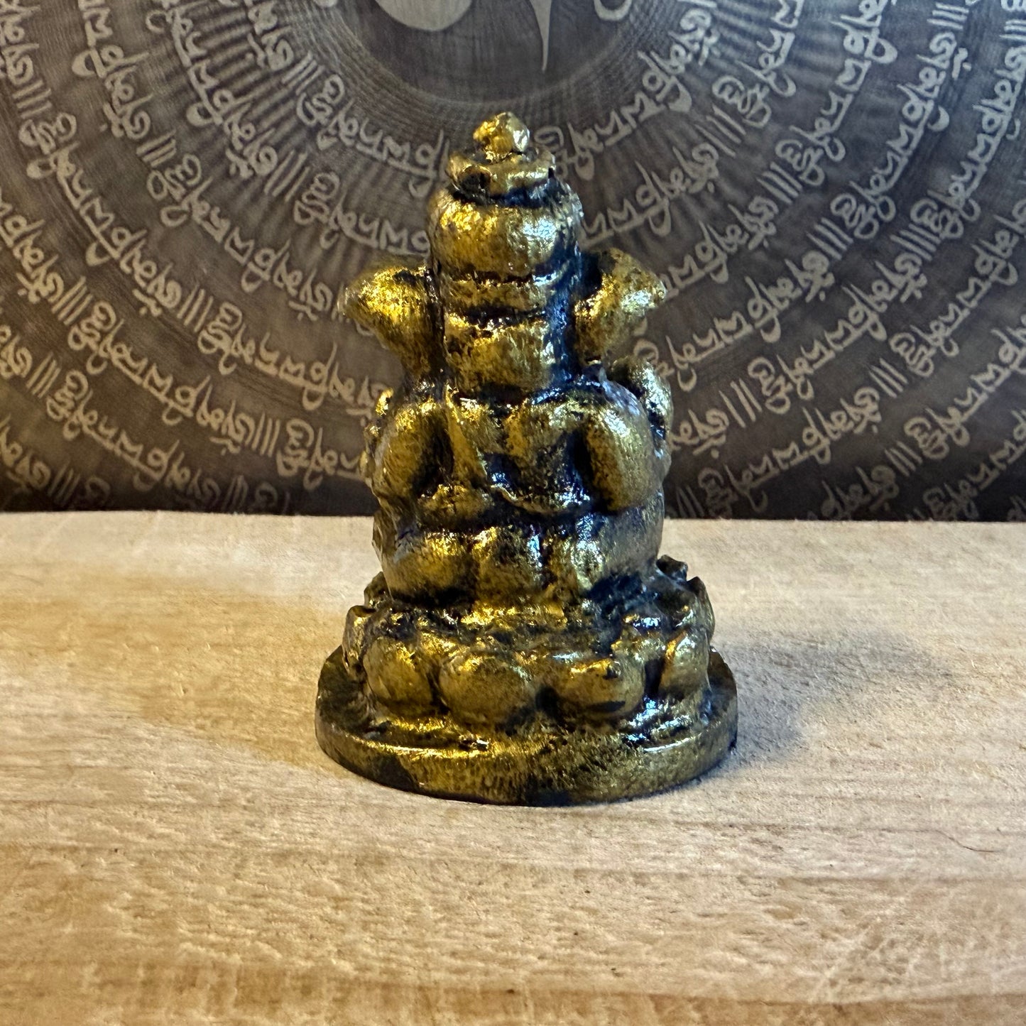 Small resin Ganesh incense holder in golden finish. Perfect for meditation, altar use, rituals, and bringing auspicious energy into your home.