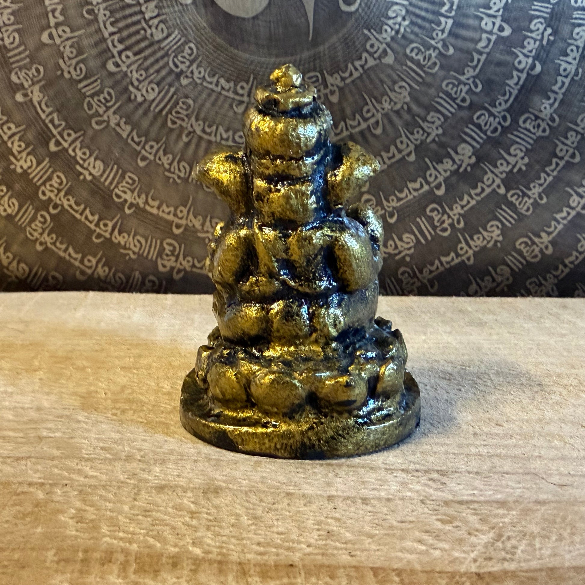 Small resin Ganesh incense holder in golden finish. Perfect for meditation, altar use, rituals, and bringing auspicious energy into your home.