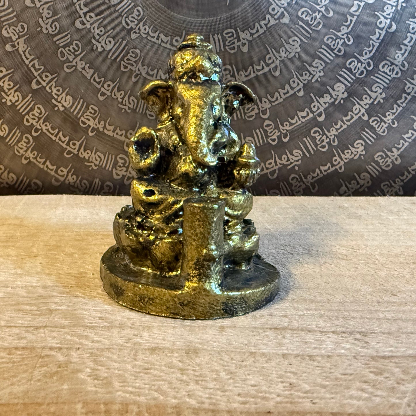 Small resin Ganesh incense holder in golden finish. Perfect for meditation, altar use, rituals, and bringing auspicious energy into your home.