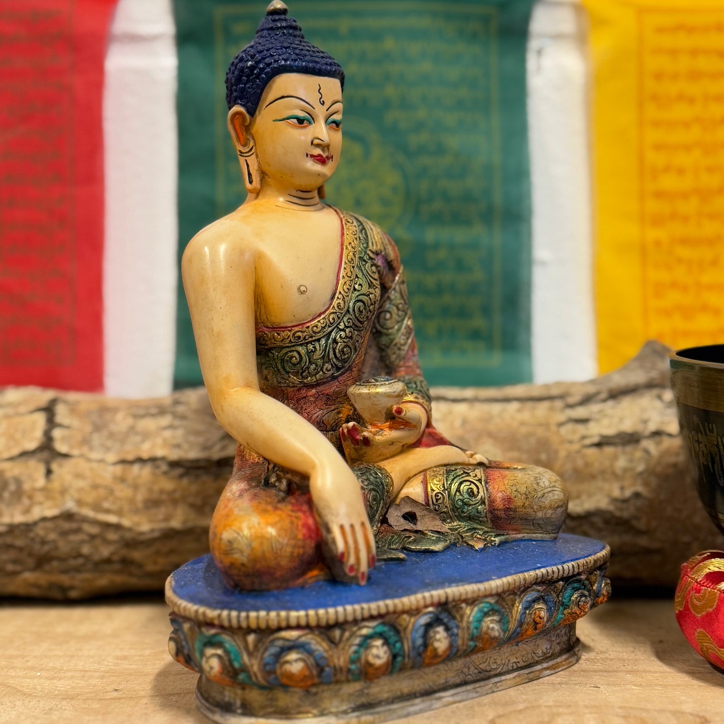 Hand-Painted Shakyamuni Buddha Statue – Traditional Thangka Style – 20cm

This stunning Shakyamuni Buddha statue, crafted from clay and resin, is a beautiful representation of supreme awareness and compassionate understanding. Painted using the traditional Thangka colors, this statue adheres to the exact color descriptions prescribed in Buddhist tradition, ensuring an authentic and vibrant depiction of the Buddha. Each piece is hand-painted by skilled artisans in Nepal, reflecting the meticulous craftsmansh